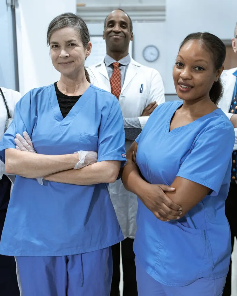 Doctors and nurses reviewing documents in hospital