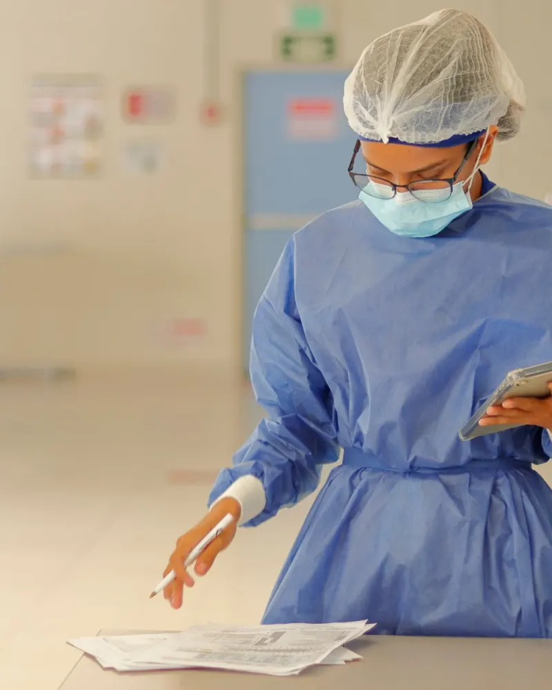 Healthcare professional in protective gear in clinic